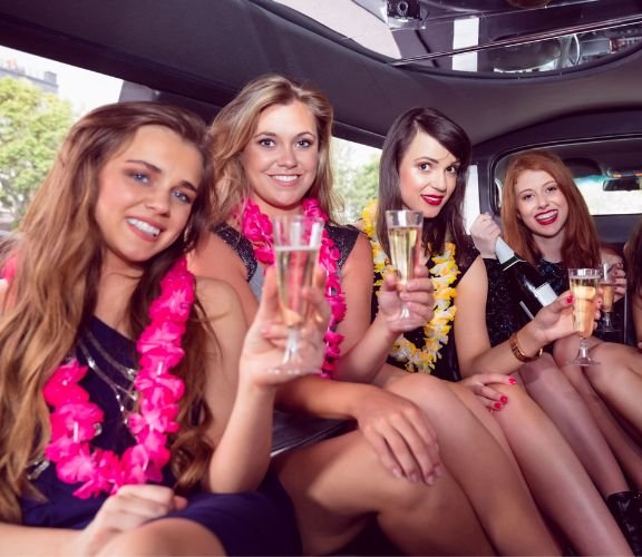 Teenage girls party in a limousine