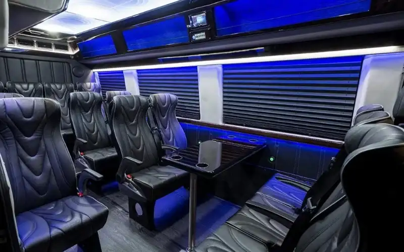 luxury bus interior with blue lighting.