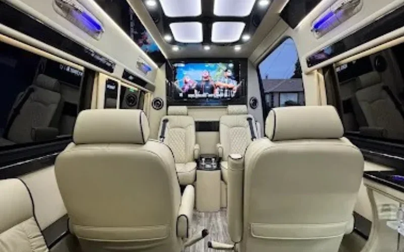 Luxury sprinter van interior with white leather seats