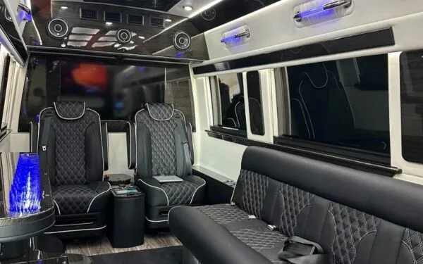 Luxury van interior with quilted leather seats and blue lighting