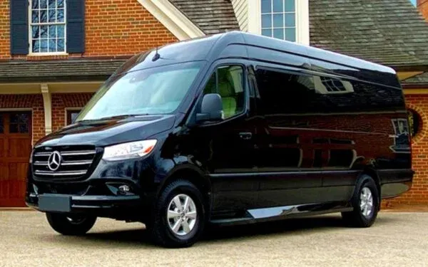 black mercedes benz sprinter van parked near house