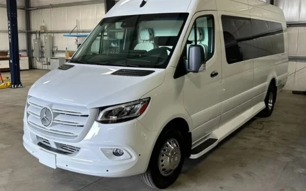 white mercedes benz sprinter van parked in garage