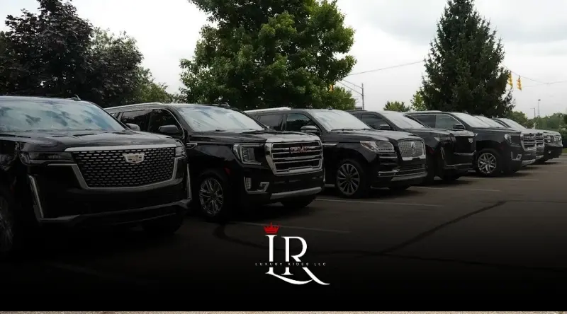 Black luxury SUV fleet lined up neatly in parking area outdoors