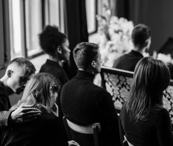 Family members gathered during a funeral service